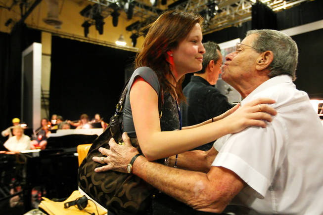Danielle Lewis, 18, gives her dad, Jerry Lewis, a kiss during rehearsal for the 45th Annual Jerry Lewis MDA Labor Day Telethon Sunday night at the South Point.  This year's telethon hopes to raise $70 million to surpass 2009's earnings of $60 million in the fight against muscular dystrophy.