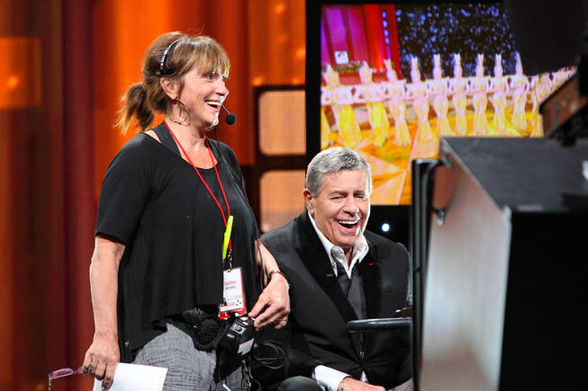 Jerry Lewis and stage manager Debbie Williams laugh with each other during the 45th Annual Jerry Lewis MDA Labor Day Telethon on Sunday night at South Point.