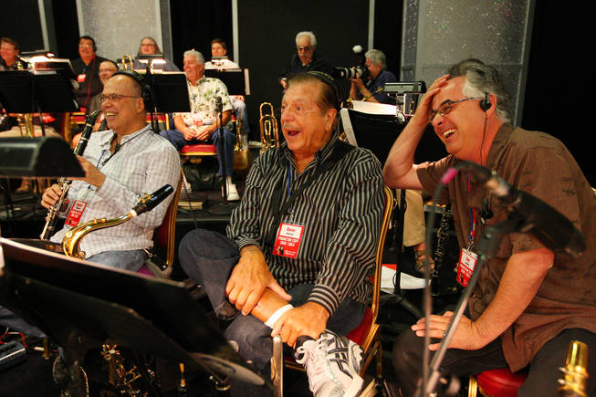 Members of Jerry Lewis' band, from right, Sal Lozano, Gene Cipriano and Bob Sheppard, crack up laughing at Jerry Lewis' jokes during rehearsal for the 45th Annual Jerry Lewis MDA Labor Day Telethon Sunday night at the South Point.  This year's telethon hopes to raise $70 million to surpass 2009's earnings of $60 million in the fight against muscular dystrophy.