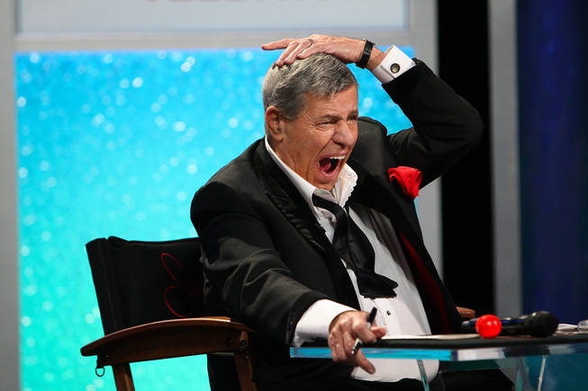 Jerry Lewis holds his head in shock after hearing of the $11 million pledge to fight muscular dystrophy Monday afternoon during the final hour of the 45th Annual Jerry Lewis MDA Labor Day Telethon at the South Point.
