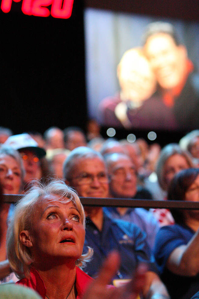 An audience member gazes upward to the tote board to watch the final tally of $58,919,838 come in during the final hour of the 45th Annual Jerry Lewis MDA Labor Day Telethon at South Point.