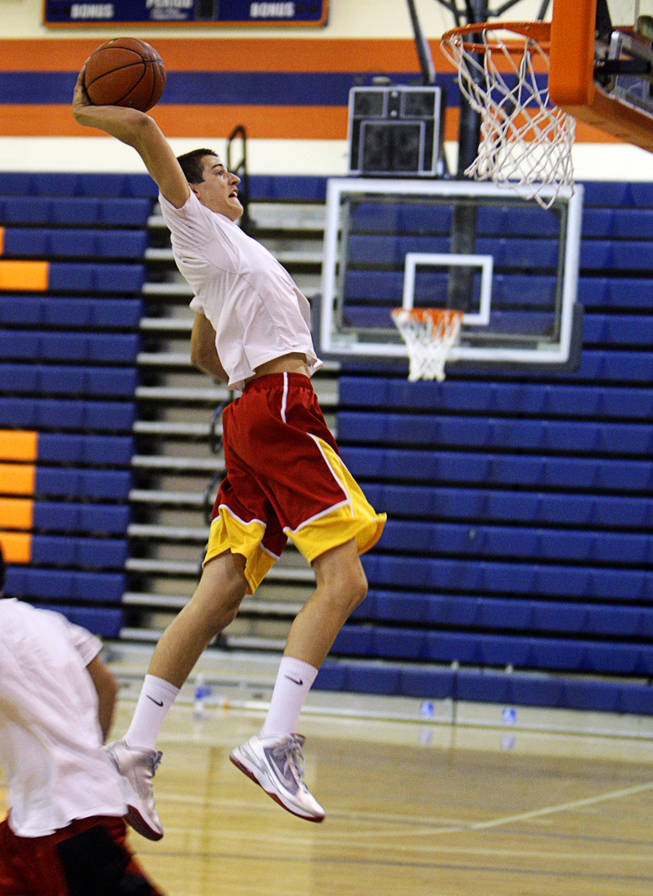 Bishop Gorman junior Rosco Allen prepares to dunk the ball during an open workout at Bishop Gorman High School Thursday, Sept. 9, 2010. The first day of the fall college basketball recruiting season was Thursday and many college coaches attended to evaluate the talent.