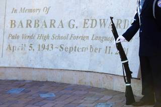 A member of the Palo Verde High School Navy Junior Reserve Officers Training Corps stands at attention during a memorial Friday in honor of Barbara Edwards, a teacher at the school who was a passenger on Flight 77, which struck the Pentagon.