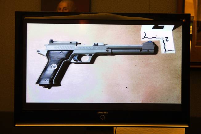 A photo of a gun that was held by the victim is displayed during an inquest for the shooting of Richard Nolton Sr. at the Regional Justice Center Friday, Sept. 10, 2010.  Nolton was shot by an officer in Henderson in July.