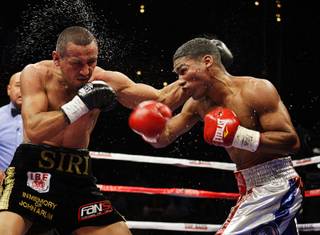 WBA champion Yuriorkis Gamboa (R) of Cuba battles with IBF featherweight champion Orlando Salido of Mexico during their title fight Saturday at the Palms.  Gamboa won the fight by unanimous decision.