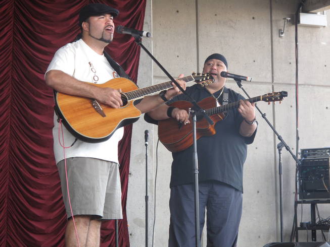 Eric Lee, left, performs Sunday afternoon at the Henderson Events Plaza during the Prince Jonah Ho'olaule'a Pacific Islands Festival. Lee is a winner of the Na Hoku Hanohano Awards, which is the Hawaiian equivalent of the Grammy Awards.
