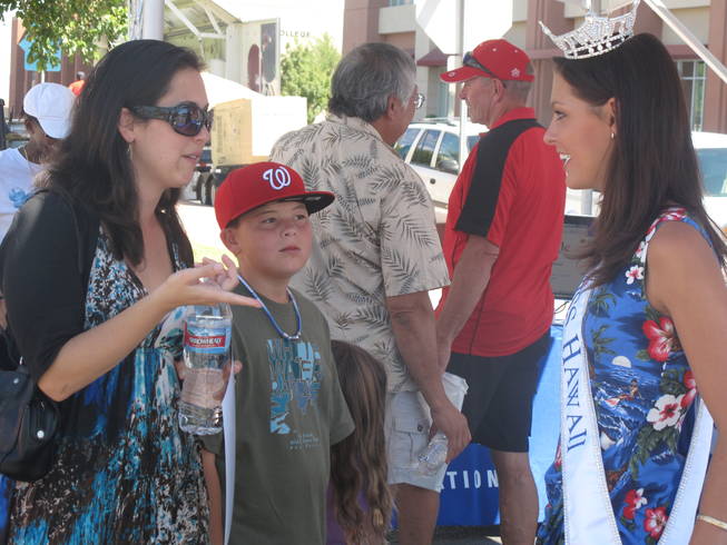 Miss Hawaii 2010, Jalee Fuselier, talks to Aimee Riley, left, at the Prince Jonah Ho'olaule'a Pacific Islands Festival in Henderson on Sunday. Riley was born in Hawaii.