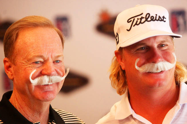 Charley Hoffman, part of UNLV golf's 1998 national championship team and a top PGA Tour player, poses for a photo with Rebel coach Dwaine Knight during a media for the 2010 Justin Timberlake Shriners Hospitals for Children Open.