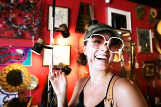Laura Marie of Las Vegas tries on sunglasses at Retro Vegas, which is located in the Arts District on South Main Street near Charleston Boulevard in downtown Las Vegas Thursday, September 16, 2010.