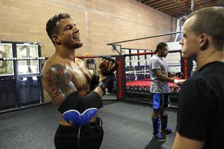UFC heavyweight fighter Frank Mir, left, laughs during a workout at his gym Friday, September 17, 2010.  Mir will fight Mirko Cro Cop Filipovic in the main event of UFC 119 in Indianapolis.