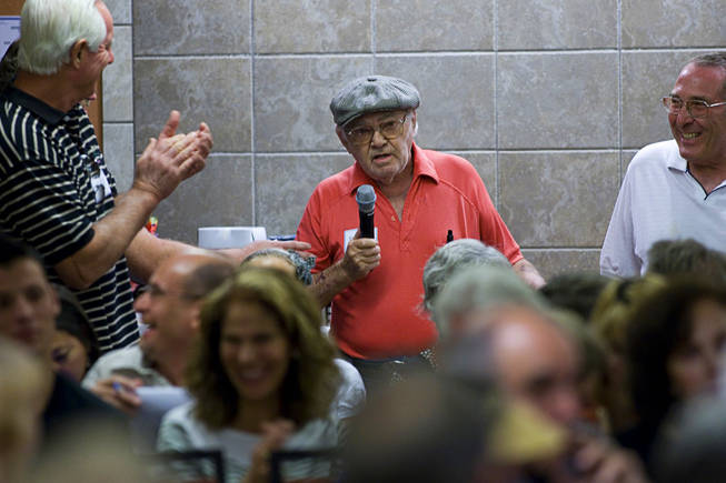 Homeowner Sam Mandell gets applause for his comments during a meeting at the La Quinta Inn Monday, September 20, 2010. Entertainer Wayne Newton hosted the neighborhood meeting to discuss development plans that would include tours on his property.