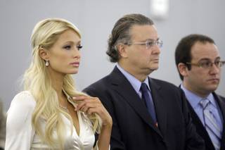 Paris Hilton stands in front of the judge with attorneys David Chesnoff, center, and Richard Schonfeld at the Regional Justice Center in Las Vegas September 20, 2010. Hilton pleaded guilty to charges stemming from her arrest for cocaine possession at the Wynn Las Vegas.