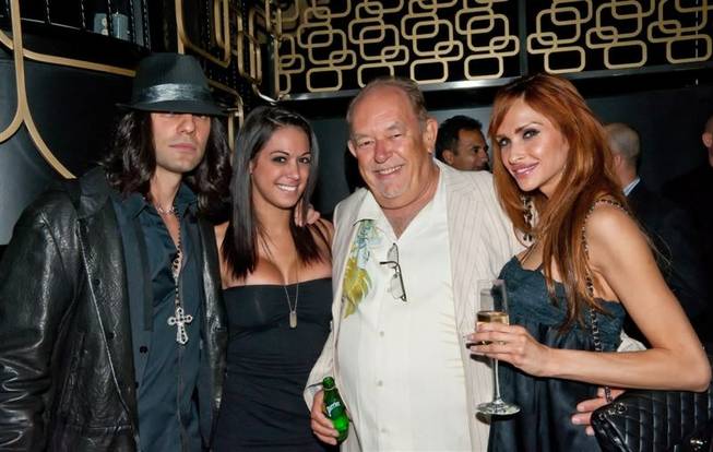 Criss Angel, Robin Leach and friends at a release party ...