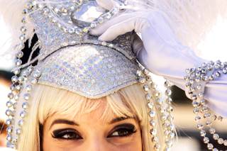 Katalin Gabriel dresses up as a showgirl during a protest against the closing of the Liberace Museum in front of the museum in Las Vegas Wednesday, September 22, 2010. Gabirel used to work in Wes Winters' show at the museum.