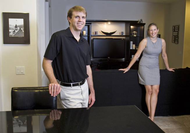 Andrew and Lindsey Patterson are shown in the kitchen-living room of their Villa Trieste home.