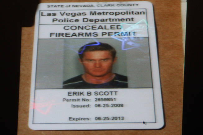 A photo of Erik Scott's concealed weapon permit is displayed during a coroner's inquest for Erik Scott at the Regional Justice Center Monday, September 27, 2010. 