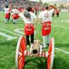 Two UNLV students walk the Fremont Cannon onto the field UNR's Mackay Stadium before the start of the 1995 football rivalry game between UNLV and UNR. It was UNLV coach Jeff Horton's first trip back to UNR after he left to be the head coach at UNLV. 