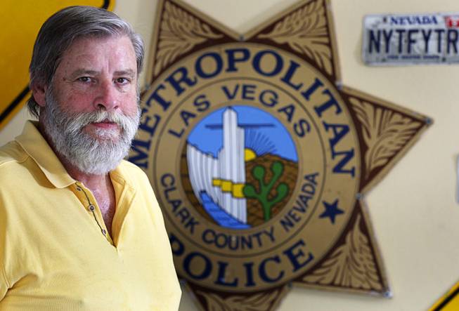 Retired Las Vegas Metro Police Sgt. Steve Custer poses at ...
