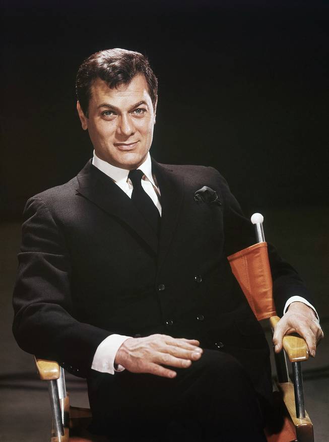 Actor Tony Curtis is shown seated in a studio chair, 1965 file photo. Curtis died Wednesday Sept. 29, 2010, at his Henderson home of a cardiac arrest at 85, according to the Clark County coroner.
