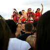 UNLV fans dance on top of a vehicle while tailgating before Saturday's football game against UNR.
