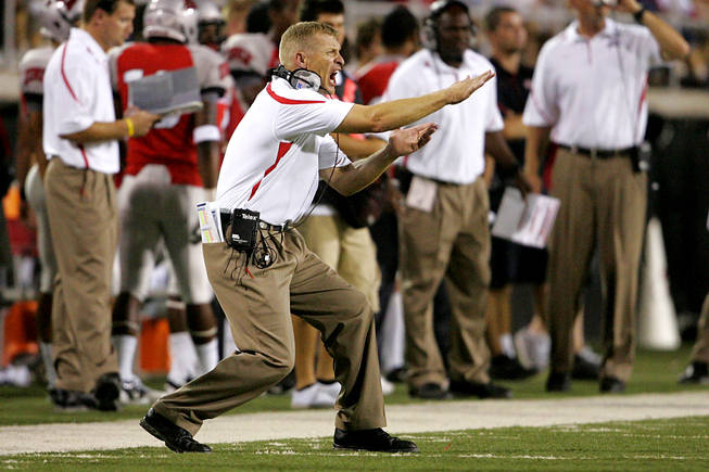 UNLV coach Bobby Hauck yells to his team during the first half of Saturday's game at Sam Boyd Stadium.