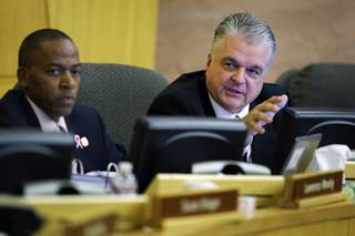 Clark County Commissioner Steve Sisolak, right, makes a motion during a Clark County Commission meeting at the Clark County Government Center Tuesday, October 5, 2010. Commissioner Lawrence Weekly listens at left. The commission voted to have a committee look into changes to the coroner's inquest system, the fact-finding process that Clark County uses after a killing by police.