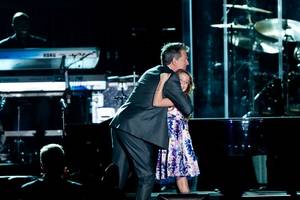 David Foster hugs Casey Glasser during the Andre Agassi Grand Slam benefit concert at the Wynn on Oct. 9, 2010.