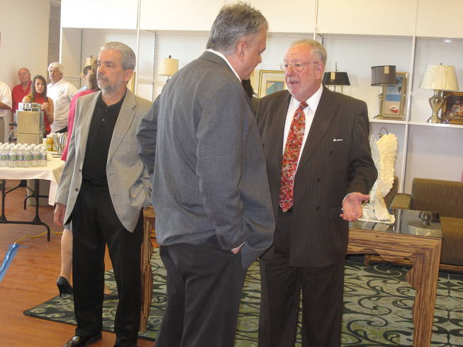 Mayor Oscar Goodman talks with an Opportunity Village supporter at the nonprofit organization's new thrift store. Goodman attended the grand opening and ribbon-cutting ceremony at the thrift store with Opportunity Village's executive director, Ed Guthrie (far left).