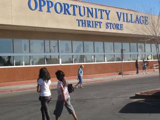 Customers enter and exit the new Opportunity Village Thrift Store at 4600 Meadows Lane in the northwest valley, near U.S. 95 and Meadows Mall. A fire ravaged the thrift store's South Main Street building in July, so the store moved to this temporary location until the previous store is rebuilt.