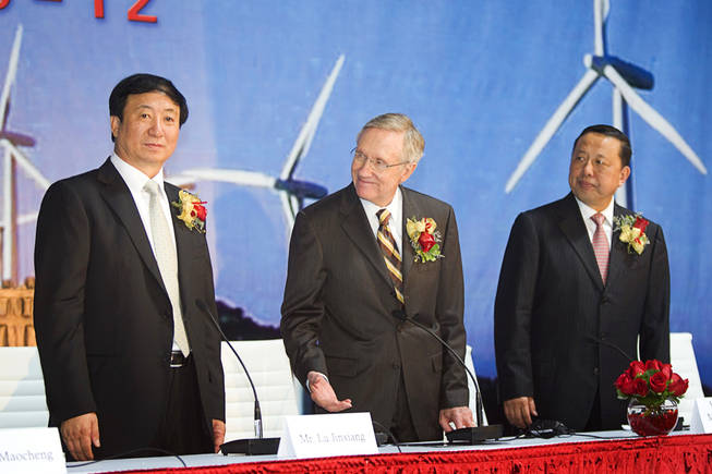 Jinxiang Lu, left, Chairman/CEO of A-Power, Senate Majority leader Harry Reid, center, and Kai Huang, deputy mayor of Shenyang, China, stand during the dedication of a new A-Power Energy Generation Systems manufacturing facility in Henderson Tuesday, October 12, 2010. The company, based in China, will produce wind turbines and LED lighting.