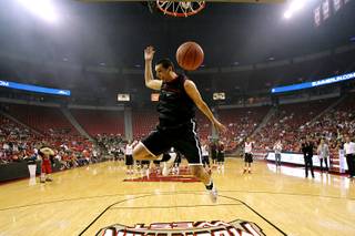 UNLV guard Karam Mashour follows through during a dunking demonstration before their First Look scrimmage Friday, October 15, 2010.
