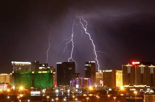 Lightning flashes over Strip casinos as a thunderstorm passes through the Las Vegas Valley on Tuesday.