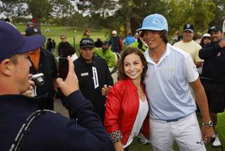 Rickie Fowler poses for a photo with Lindsey Raible of Arkansas during the Pro Am portion of the Justin Timberlake Shriners Hospitals for Children Open golf tournament at TPC Summerlin Wednesday, October 20, 2010.