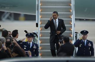 President Barack Obama salutes after landing at McCarran International Airport in Las Vegas Friday, October 22, 2010. 