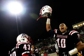 Liberty's Samuel Tai celebrates after beating Foothill Friday 28-14 for the Southeast Division title.