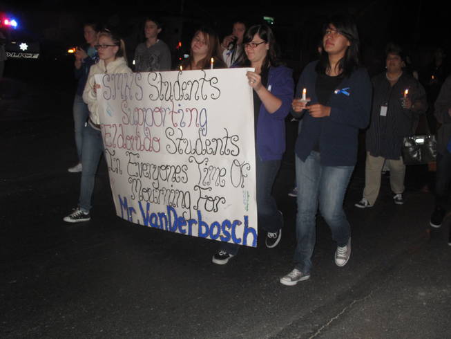 Students from another Las Vegas high school show their support for the Eldorado High School community following the death of teacher Timothy VanDerbosch. Hundreds participated in a memorial walk and candlelight vigil along Washington Avenue on Monday morning.