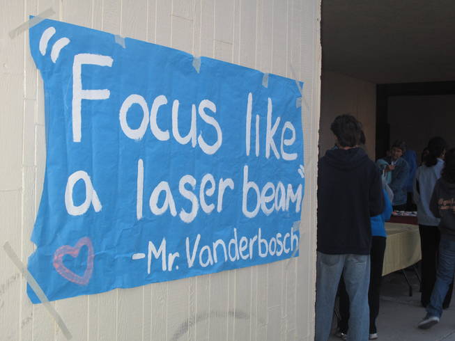 Banners honoring teacher Timothy VanDerbosch adorn the walls of Eldorado High School. 