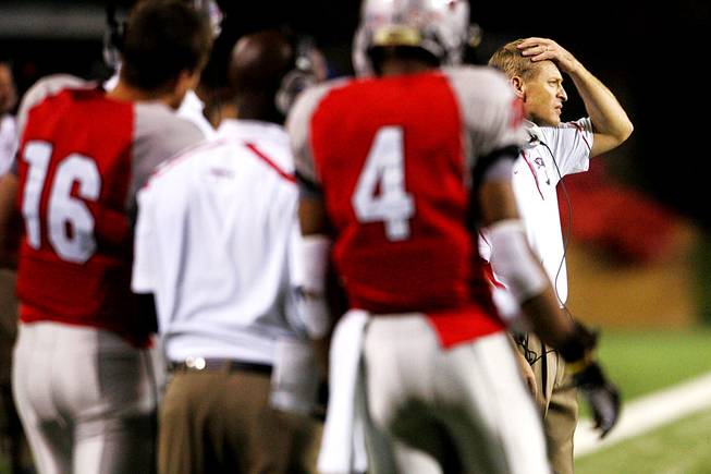 UNLV head coach Bobby Hauck puts his hand on his head during the second half of their game against Saturday, October 30, 2010. Fourth-ranked TCU won the game 48-6.