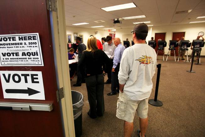 Henderson residents stand in line to cast their vote during Election Day at the Paseo Verde Library in Henderson Tuesday, November 2, 2010.