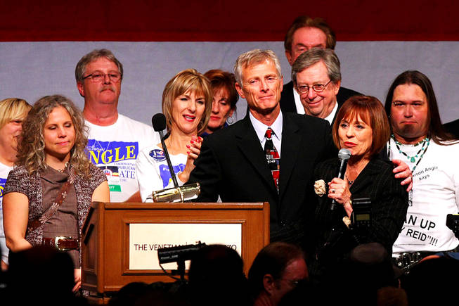 Sharron Angle is joined by her husband, Ted, while delivering her concession speech at the Republicans' election-night party early Wednesday at the Venetian.