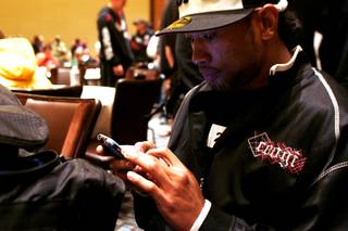 Danny Davis Jr. uses his phone to text messages while waiting for auditions for the 13th season of The Ultimate Fighter Thursday, November 4, 2010.