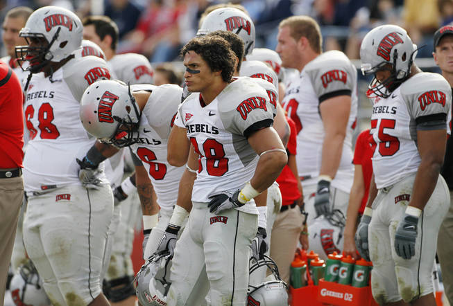 UNLV players, from left, Nate Holloway, Mike Clausen, Calvin Randleman and Nate Carter react during the final seconds against BYU, Saturday, Nov. 6, 2010, in Provo, Utah. BYU defeated UNLV 55-7. 