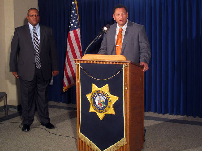 Metro Police Lt. Clint Nichols, from the Robbery Bureau, speaks to the media Saturday about the arrest of suspects in the murder of Eldorado High School teacher Timothy VanDerbosch. At left is Lt. Lew Roberts from the department's Homicide Bureau.