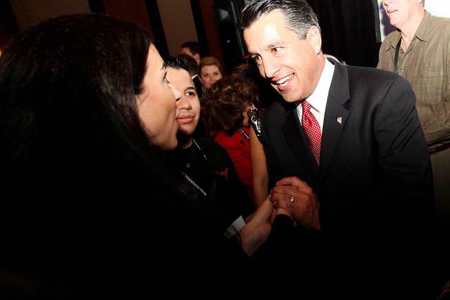 
Brian Sandoval celebrates with supporters after defeating Rory Reid in the governor's race Tuesday. 