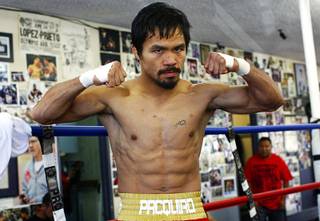 Filipino boxer Manny Pacquiao poses during a workout at the Wildcard Boxing Club in Hollywood, Calif. Monday, November 8, 2010. Pacquiao takes on Antonio Margarito at Cowboys Stadium in Arlington, Texas on Saturday, November 13.