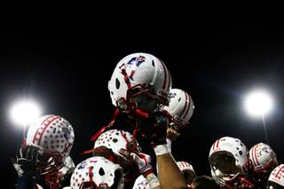Liberty celebrates after defeating Canyon Springs 26-13 Thursday in the Sunrise semifinal.