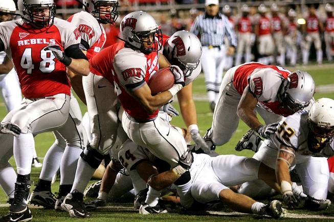 UNLV running back Tim Cornett falls across the goal line during the Rebels' Mountain West Conference game against Wyoming on Saturday, Nov. 13, 2010, at Sam Boyd Stadium.