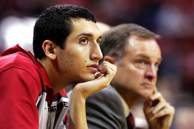 UNLV freshman wing Karam Mashour sits on the bench next to head coach Lon Kruger during the Rebels' season opener against UC Riverside Friday, November 12, 2010 at the Thomas & Mack Center. Mashour has decided not to redshirt his freshman season. 