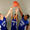 Basic basketball players, from left, Paul Bunkley, Kyle Taitano and Kevin Bayes.