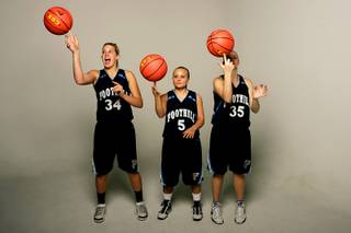 Foothill basketball players Brianna Higgins, Samantha Gruettner and Cheryl Harless.